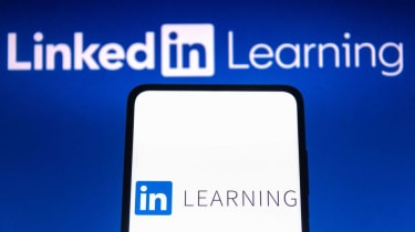 A smartphone with the LinkedIn Learning logo displayed