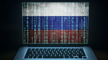 Russian hacking on a laptop mockup with code sprawling over the screen