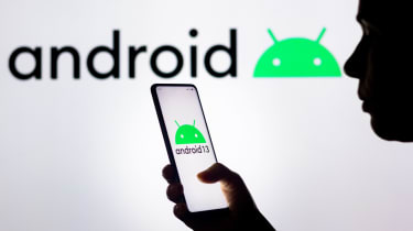 Android phone being held aloft in front of a white background with the Android logo appearing on it