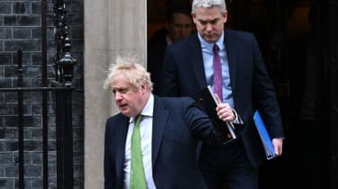 British Prime Minister Boris Johnson and Downing Street Chief of Staff Steve Barclay leave 10 Downing Street at Downing Street on February 22, 2022 in London