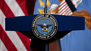 US Department of Defense badge mounted on a lectern