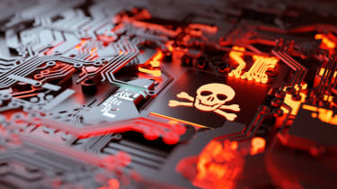 Abstract image showing a red circuit board containing a square chip with a glowing skull etched into it
