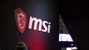 The MSI logo on a wall at a conference, lit in red LED lighting